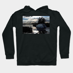 A boat travelling the Norfolk Broads near dusk Hoodie